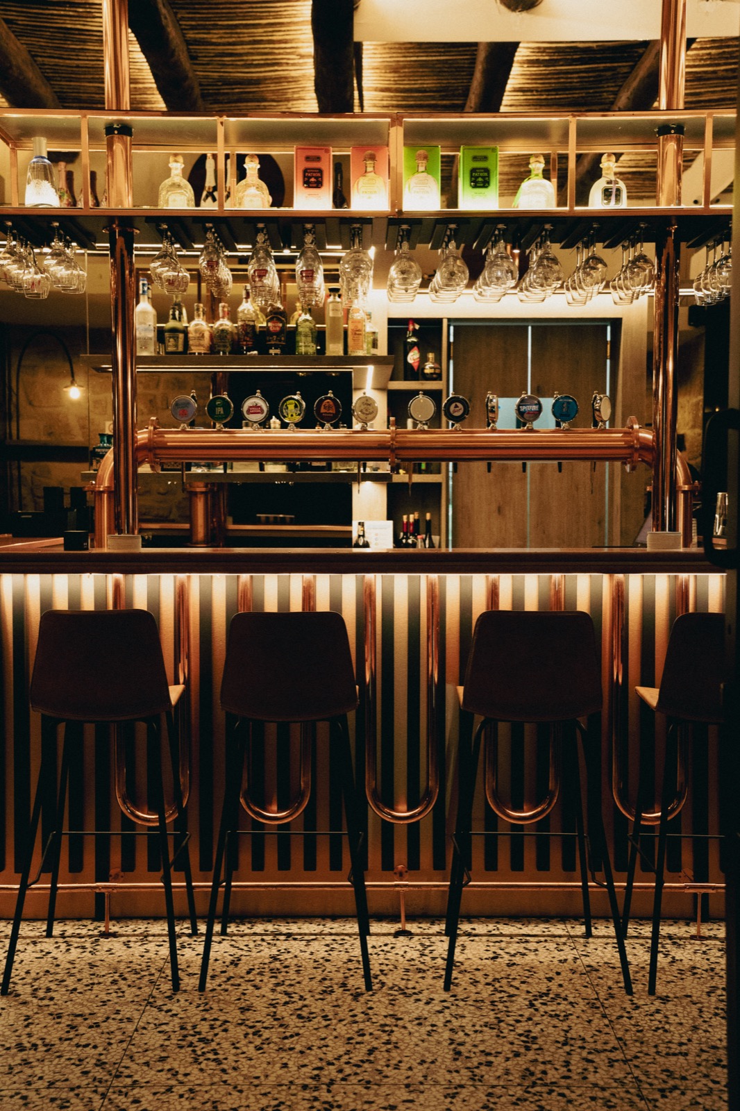 Bridge Brew Bar interior — beer taps, cocktail bar, and warm atmosphere in Chiaia, Naples